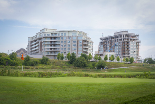 Tournament participants in front of The 6th condominium, overlooking Angus Glen’s south course.